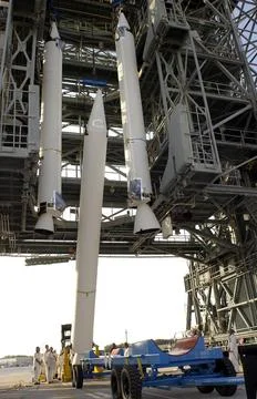 KENNEDY SPACE CENTER, Fla. - A third solid rocket booster is lifted into t... Stock Photos