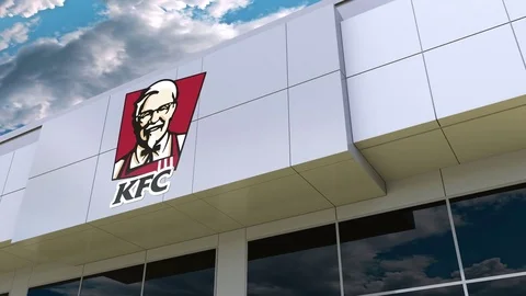 Kentucky Fried Chicken KFC logo on the modern building facade. Editorial 3D Stock Footage