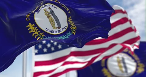 Kentucky state flags waving along with the national flag of the United States Stock Footage 196823320