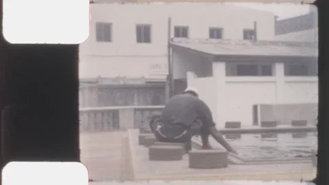 Kenya 1960s, man performing ablution at Jamia Mosque courtyard Stock Footage 327372371