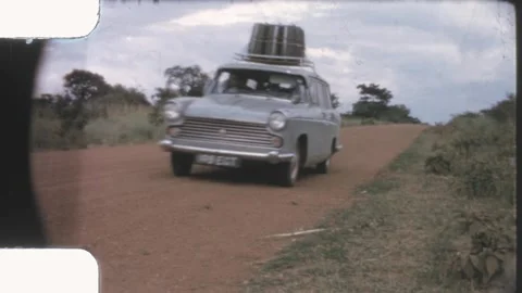 Kenya 1970s, Austin Freeway driving on dirt road toward camera Stock-Footage 313779845