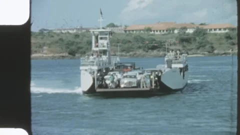 Kenya 1970s, Likoni Ferry view with cargo ship in Mombasa Video stock 313508314