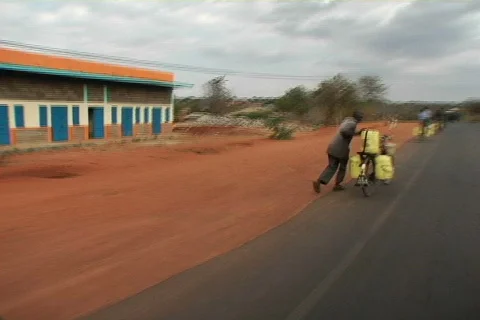 Kenya hauling buckets 01 Stock Footage 607828