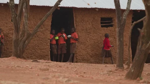 Kenya, Loima - May 5, 2025: Schoolchildren in uniform relax after school and 動画素材 312723972