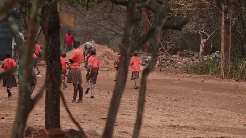 Kenya, Loima - May 5, 2025: Schoolchildren in uniform relax after school and Video stock 312724486
