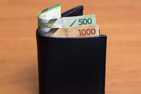 Kenyan shilling in the black wallet Stock Photos