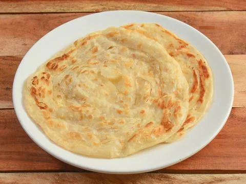 Kerala Paratha, a layered flat bread using wheat flour, popular dish in south Stock Photos