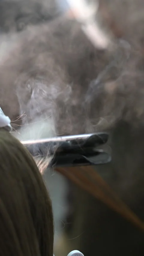 Keratin treatment process with steam in a professional salon. High temperat.. Stock Footage 340227744