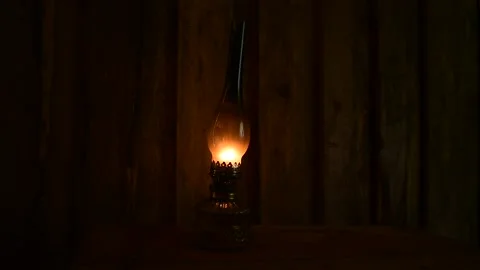 Kerosene lamp against the background of a rough plank wall Stock Footage 138390540