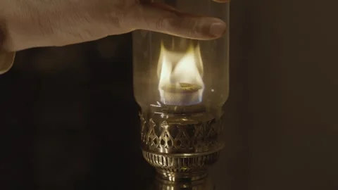 Kerosene lamp. A burning candle on the background of a kerosene lamp. Festive Stock Footage 264584272