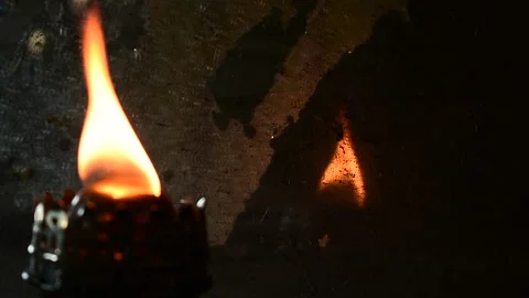 Kerosene lamp fire reflected in an old mirror Stock Footage 138145891