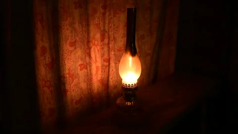 Kerosene lamp in front of the curtain, rustic interior Stock Footage 138390654