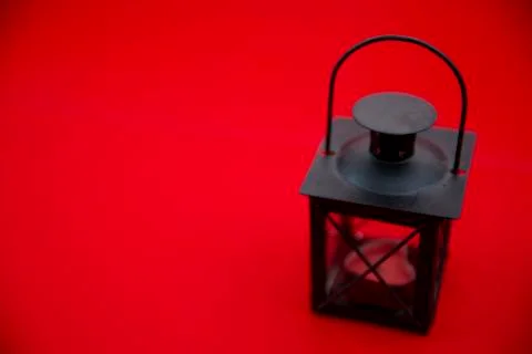Kerosene lamp on a red background Stock Photos