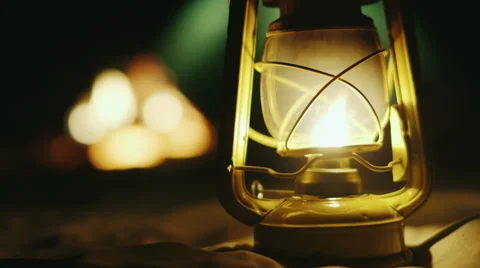 Kerosene lamp stands on the sand, in the background a fire tent Stock Footage