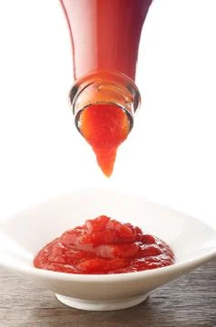 Ketchup falling from bottle Stock Photos