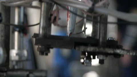 Ketchup packs falling from a conveyor machine in a tomato processing plant Stock Footage 119967417