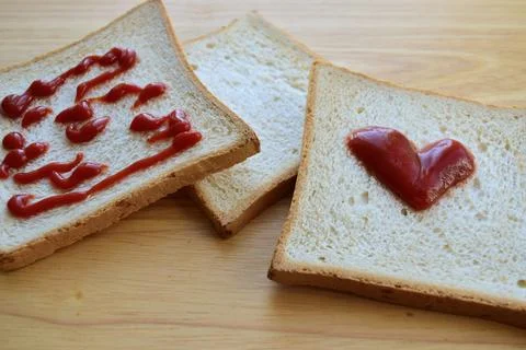 Ketchup spread on toast Stock Photos