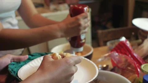 Ketchup Squeezed onto Hot Dog Stock Footage 53075157