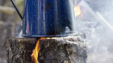 Kettle being heated in bonfire Stock Footage 68493920