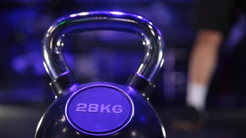 Kettle bell on the gym floor Stock Footage 104925892