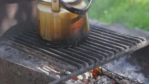 Kettle to boil in a camping for making tea on a campfire 스톡 동영상 196939273