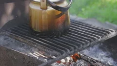 https://images.pond5.com/kettle-boil-camping-making-tea-footage-196939273_iconm.jpeg