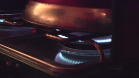 Kettle boiling and fire crackling inside Tipi in the Dyfi Valley Forest of Wales Stock Footage 130350201