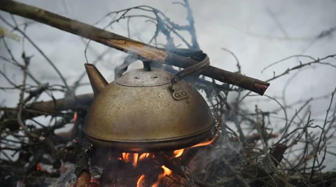 Kettle boiling on the bonfire Stock-Footage 61009407