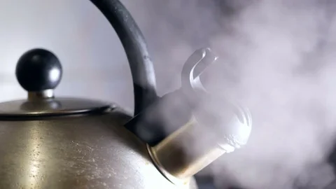 Kettle boiling hot stove Stock Footage 85057516