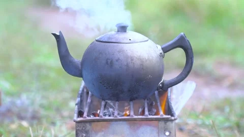 The kettle is boiling on an outdoor vacation. Stock Footage 153384213