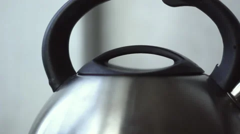 Metallic modern electric kettle with water on table are boiling and turn  off Stock Video Footage by ©AntonKor #542968698