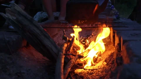 Kettle Boils on an Open Fire at Night Stock Footage 250239675