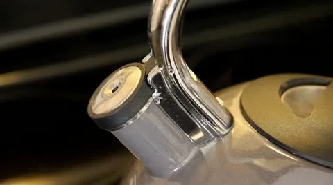 A Kettle Boils while a Loud Whistle Sound is Made Stock Footage 10967244