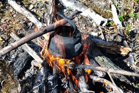 Kettle on the bonfire Stock Photos