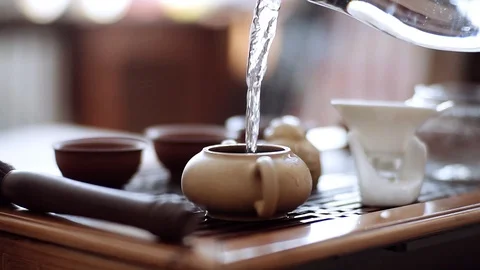 In a kettle with brewed leaves pour boiling water and brew fragrant tea Stock Footage 113088085