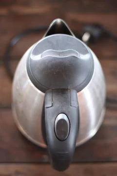 Kettle brown background. Stock Photos