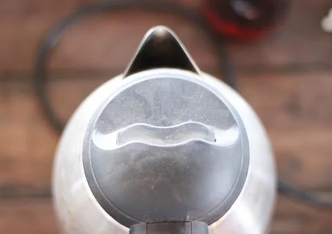 Kettle brown background. Stock Photos