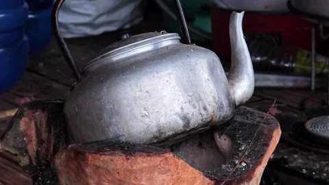 The kettle on clay fire pot. Stock Footage 305371235