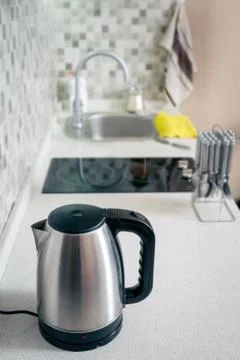 Kettle closeup in the kitchen Stock Photos