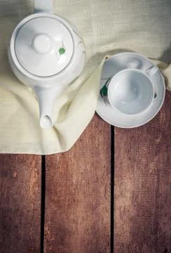 Kettle with cup on table Stock-Fotos