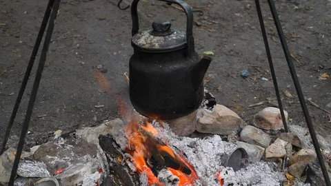 Kettle on a fire in the base camp in nature Stock Footage 118770898