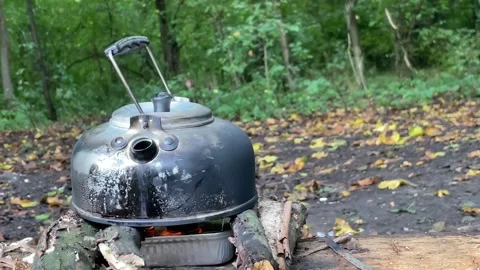 Kettle on fire in the forest Stock Footage 252076853