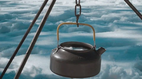 Kettle on a fire in the winter forest Stock Footage 87586280