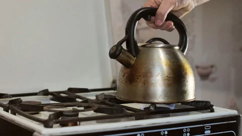 The kettle on the gas stove.Slow motion.rule third place for text Video stock 130563342