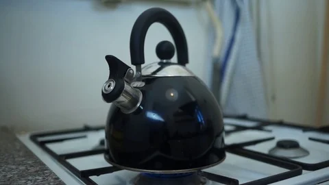 Kettle on gasstove Stock Footage 87857478