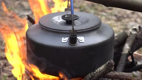 Kettle on an open fire Stock Footage 152373765