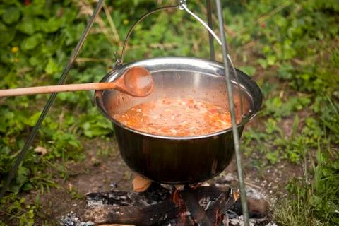 Kettle over campfire Stock Photos