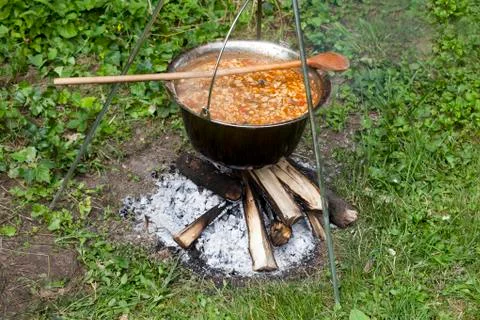 Kettle over campfire Stock Photos