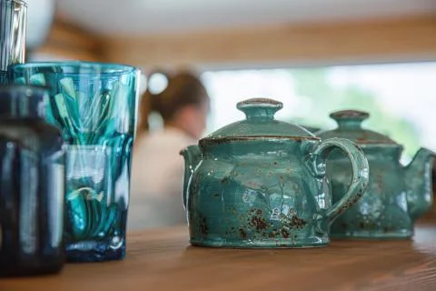 The kettle is placed on the table with tea Stock Photos