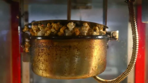 Kettle popcorn maker machine caramel flavor Stock Footage 307932321